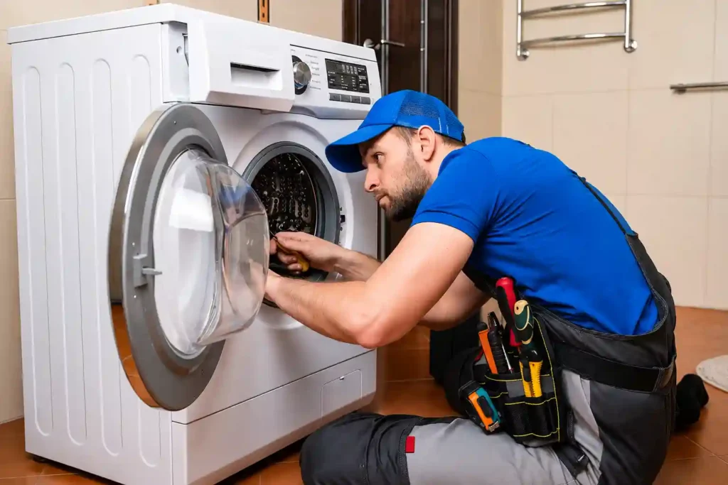 Expert repairing a front-load washing machine with precision.